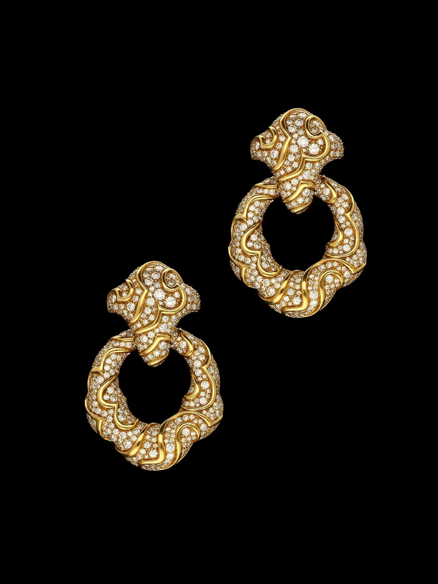 DIAMOND DAY &amp; NIGHT ONDA EARRINGS BY MARINA B

Set with round brilliant cut diamonds. Estimated diamond weight 20.00 carats. Estimated colour G on average. Estimated clarity VS on average. Diamonds are bright &amp; lively. Mounted in 18kt yellow 