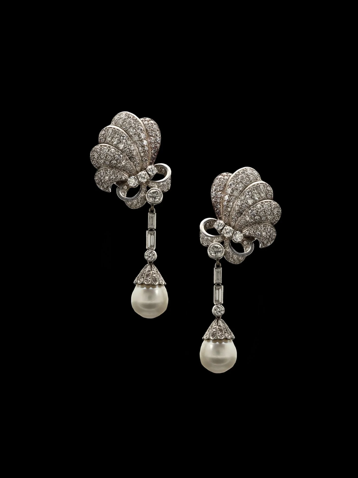 MID 20TH CENTURY PEARL &amp; DIAMOND DAY AND NIGHT EARRINGS

Set with round brilliant cut diamonds &amp; pearls. Estimated total diamond weight 4.50 carats. Estimated colour H-I on average.  Estimated clarity VS-SI on average. Diamonds are bright &am