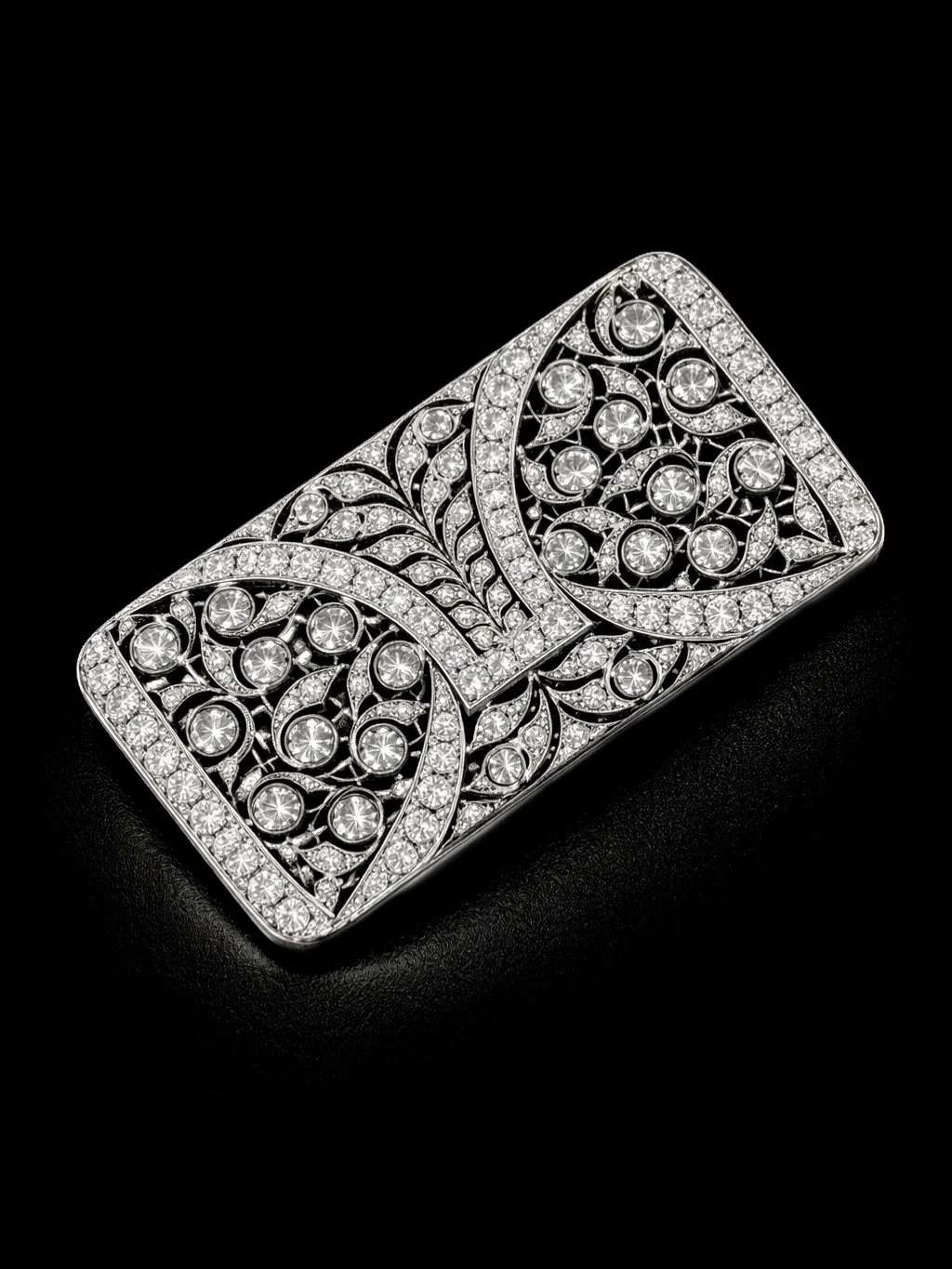 ART DECO DIAMOND BROOCH

Set with old mine cut and old european cut diamonds. Estimated total diamond weight 4.85 carats. Estimated colour G-H on average. Estimated clarity SI on average. Diamonds are bright &amp; lively. Mounted in Platinum. Circa 1