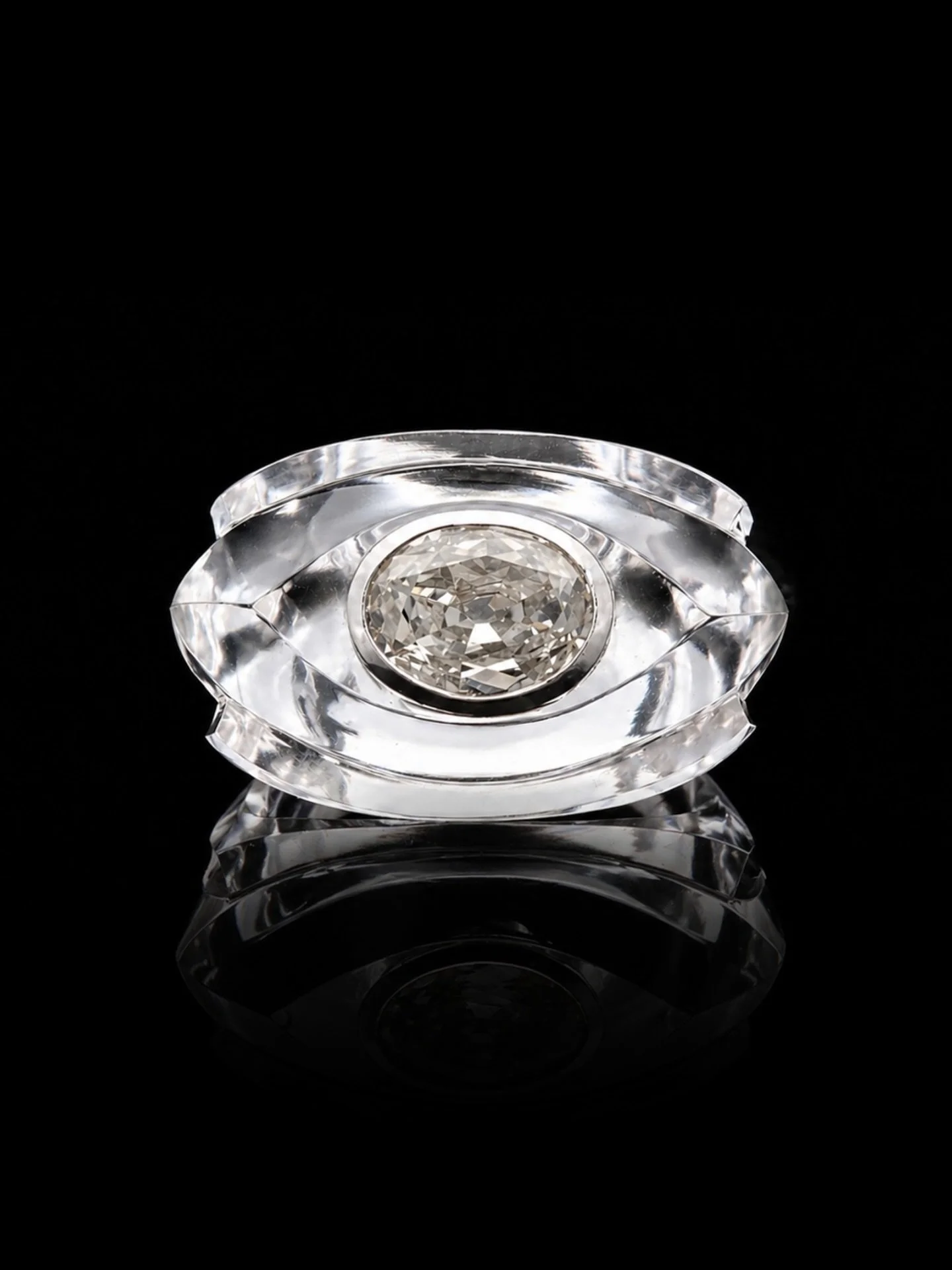 ROCK CRYSTAL &amp; DIAMOND RING

Set with a rock crystal and an oval cut diamond. Estimated centre diamond weight 1.57 carats. Estimated colour K-L-M on average. Estimated clarity VS-SI on average. The diamond is bright &amp; lively. Mounted in 18kt 
