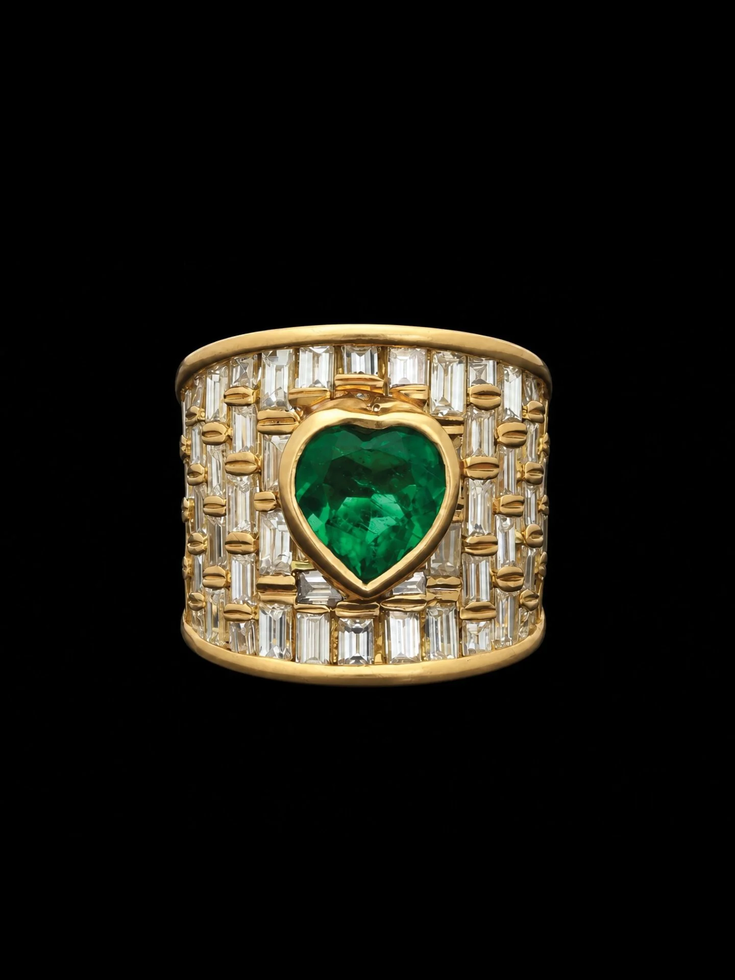 LATE 20TH CENTURY EMERALD &amp; DIAMOND RING

Set with a heart shaped Colombian minor oil emerald and baguette cut diamonds. Estimated total emerald weight 2.46 carats on average. Estimated total diamond weight 1.80 carats on average. Estimated colou