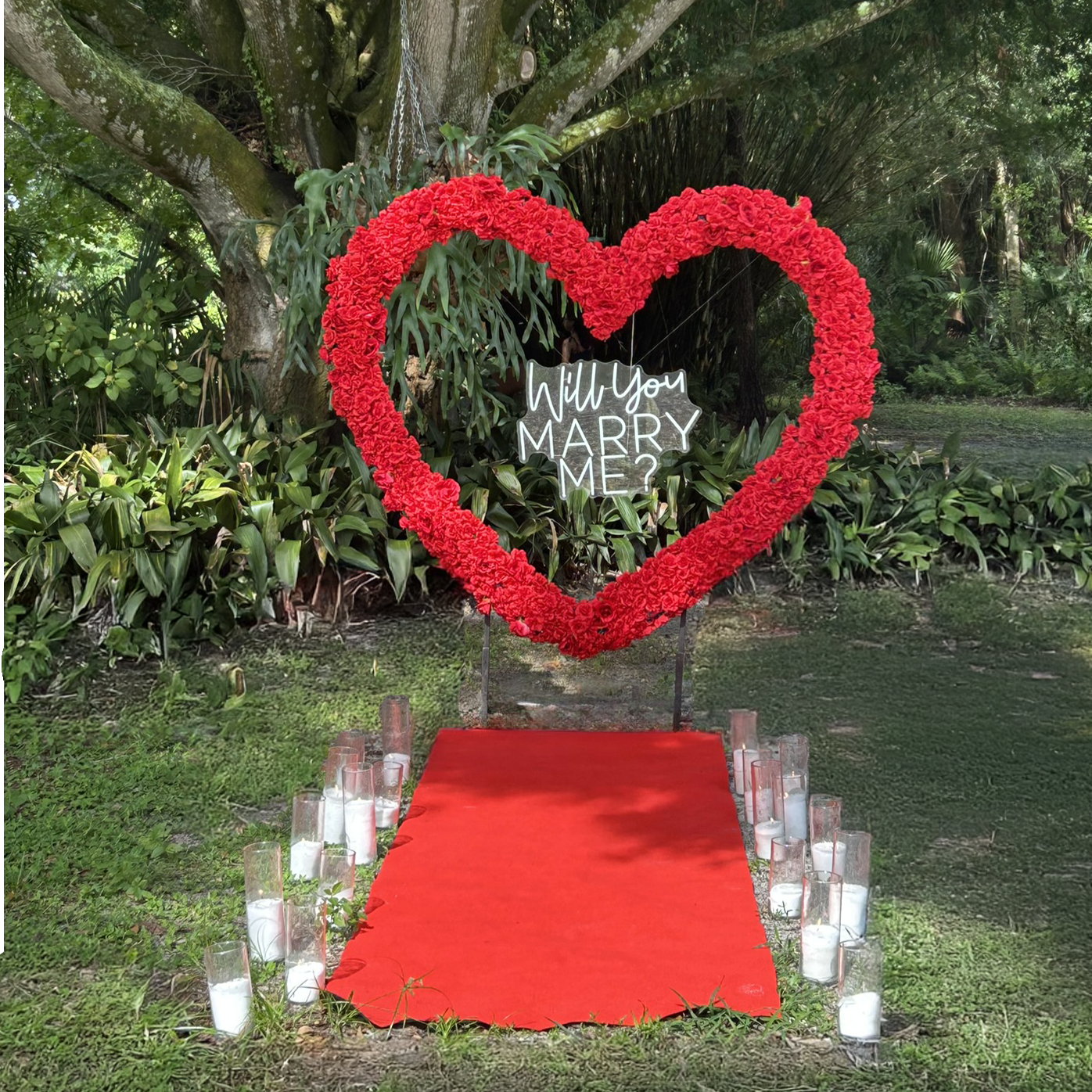 Basic Package
$450
Available in both red or white: Heart Shape Rose Arch, Red Carpet, “Will You Marry Me” LED Sign, Sand Wax Candles, Two Ground Florals, Faux Rose Petals***