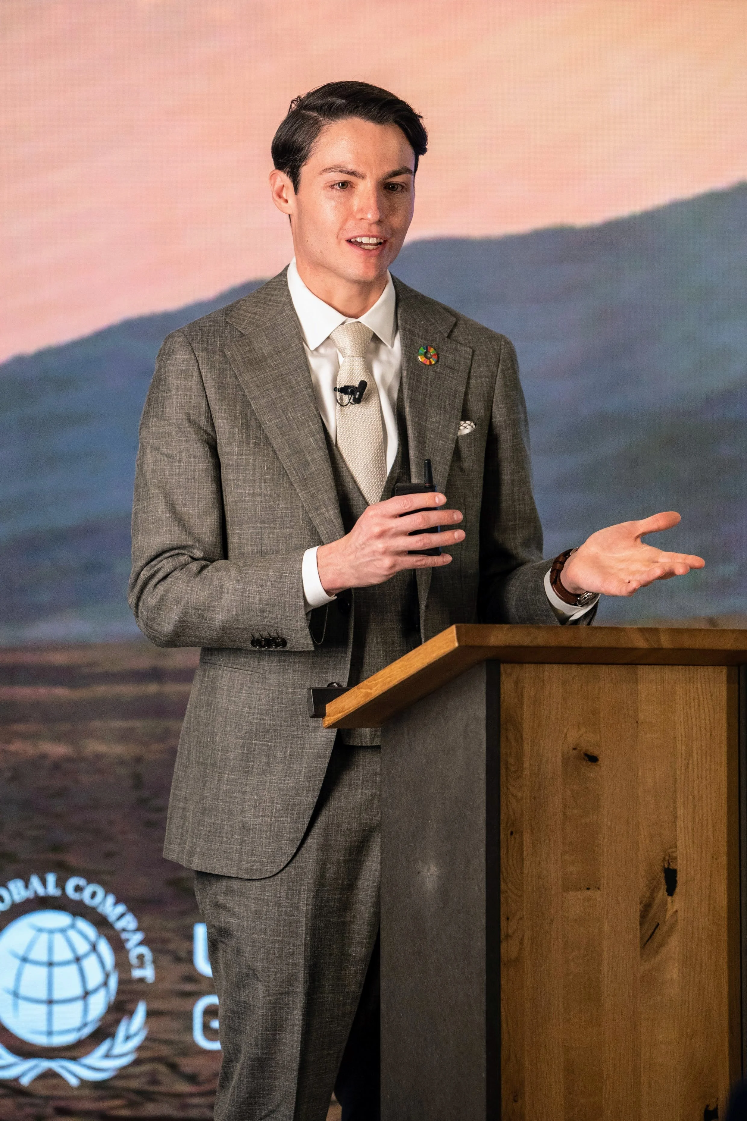 Michael D. Hughes speaking at a podium at a UN Global Compact CEO breakfast