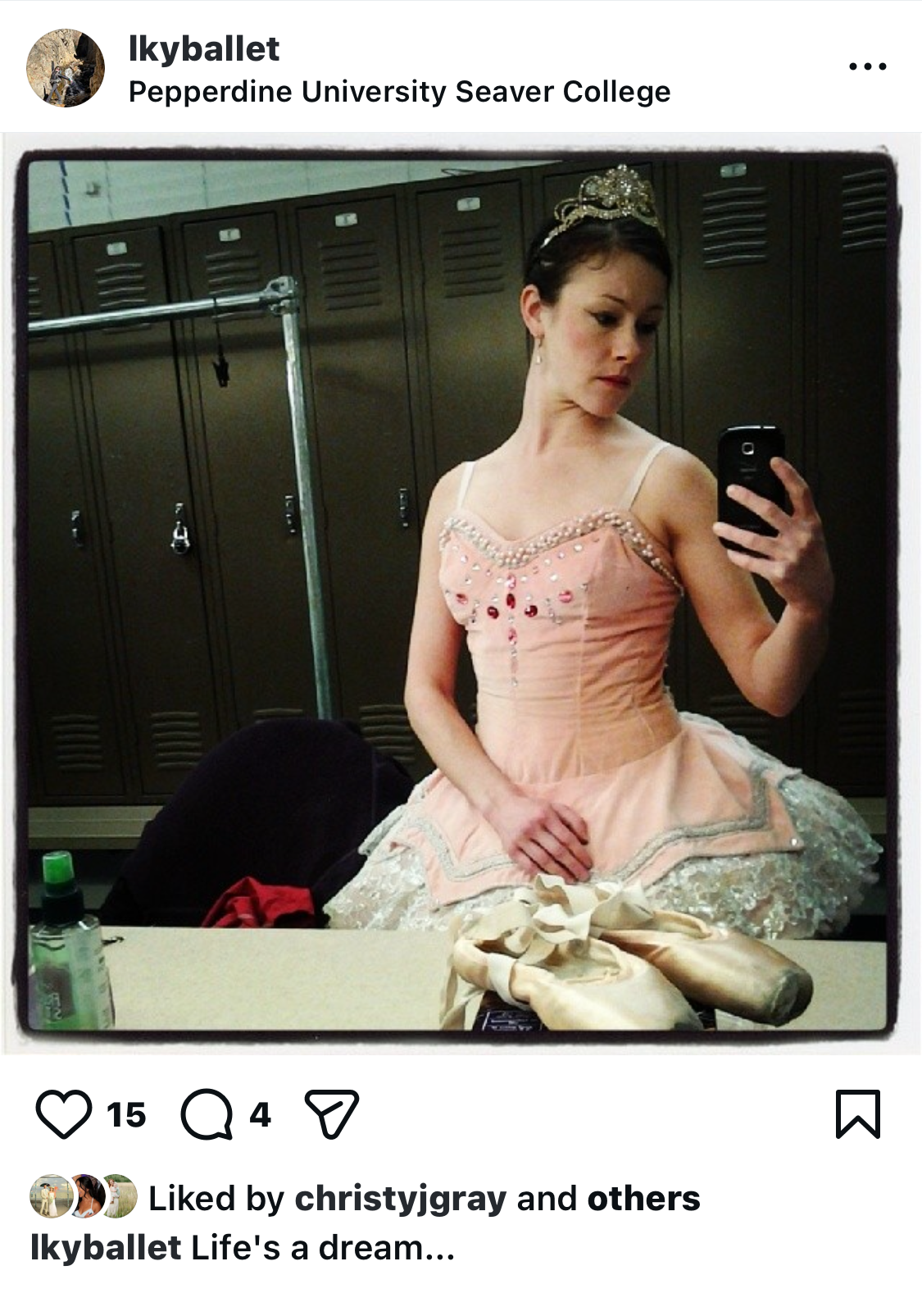 a selfie backstage of the author in a pink tutu with jewels on the bodice and pointe shoes on counter