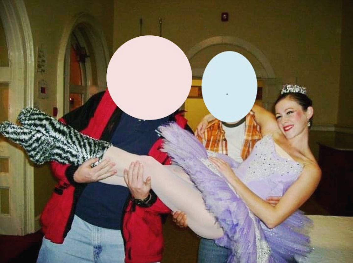 two hidden identity people hold up the author who wears a purple tutu and crown