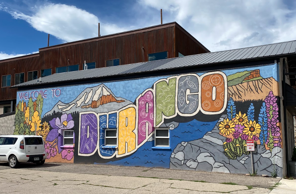 mural on building wall states Welcome to Durango in bright colors and lots of wildflowers