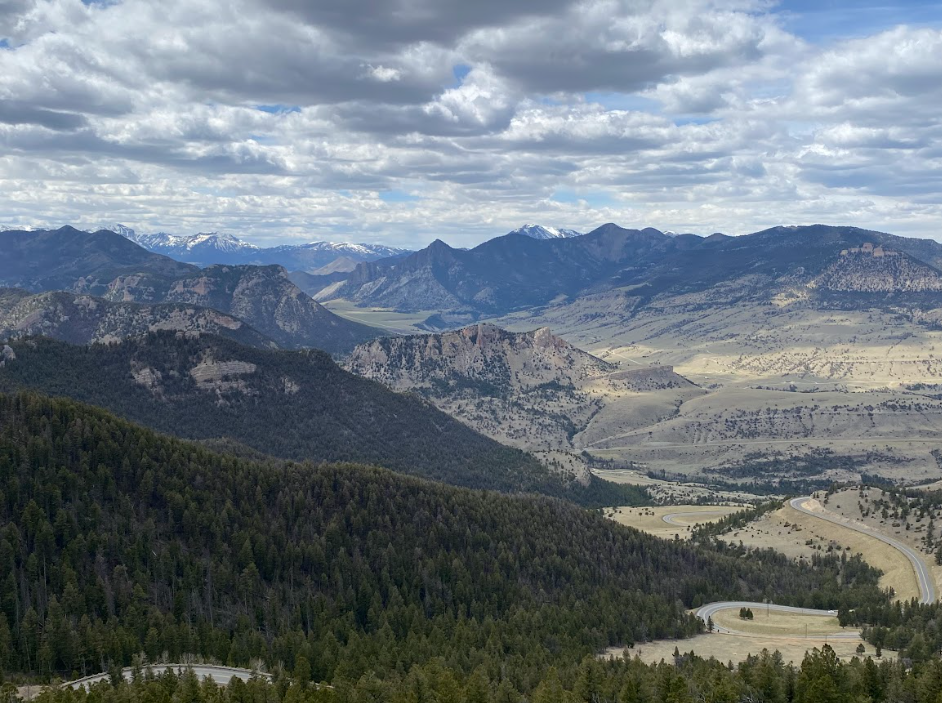 a vast swath of land and trees leading to mountains