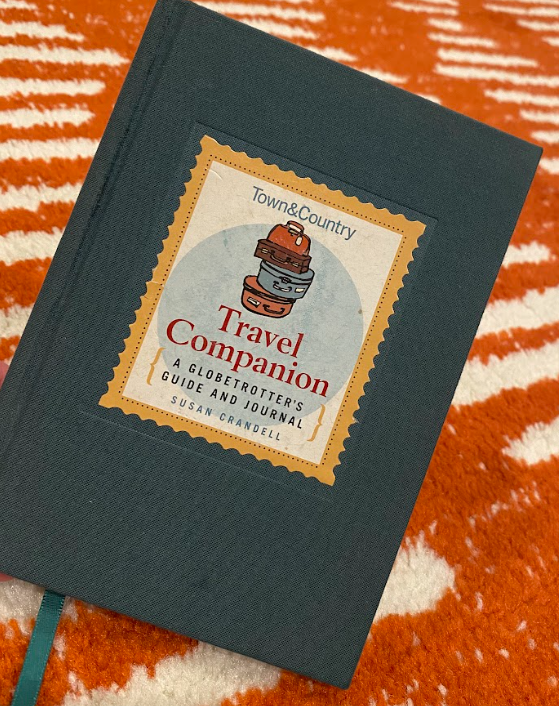 a dark green journal labeled Travel Companion: A Globe Trotter's Guide and Journal by Susan Crandell