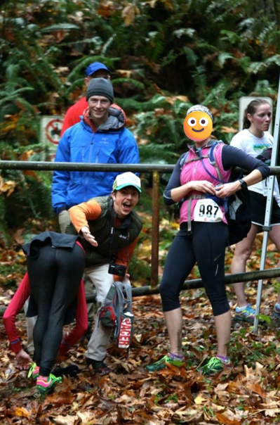 woman bending over to tie shoelace while man pretends to smack her bottom while several people look at the camera