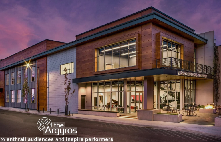 the Argyros performing arts center two-story building made with floor to ceiling glass windows on the main level