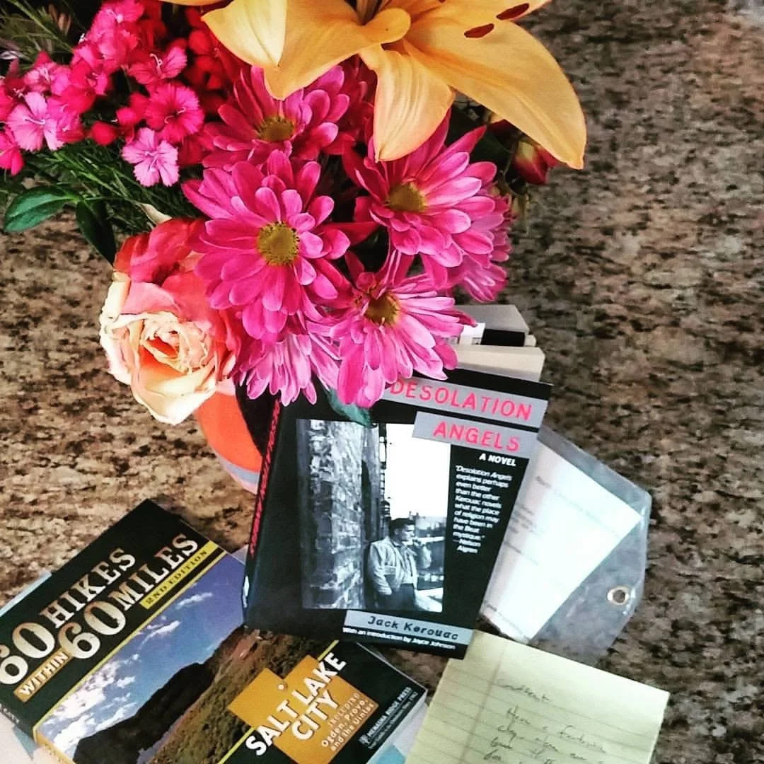 flower arrangement and book Desolation Angels by Jack Kerouac
