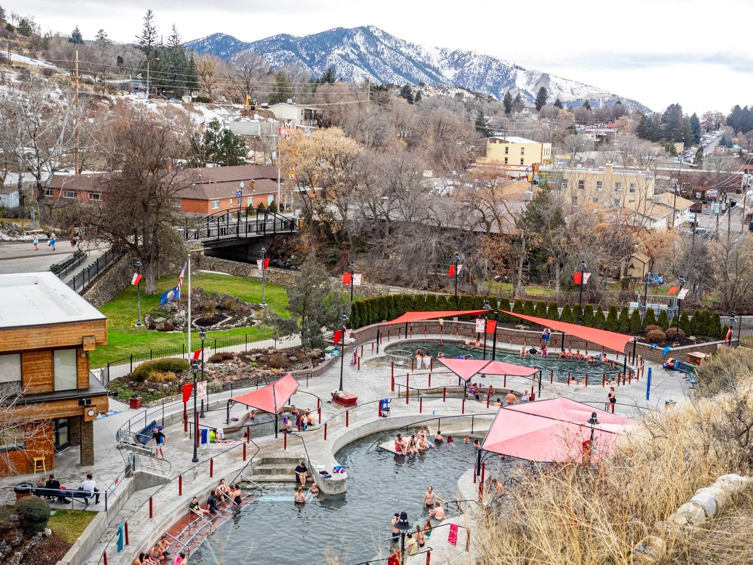picture from above the hot springs that also shows the town and mountain backdrop