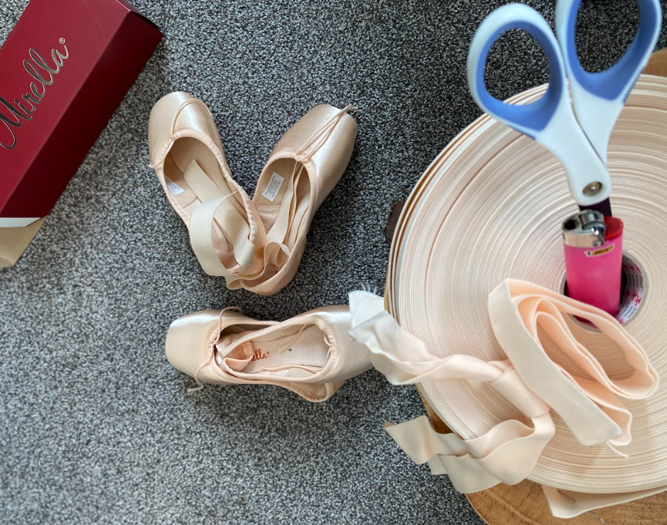 pointe shoes, elastics, ribbons, and a sewing kit