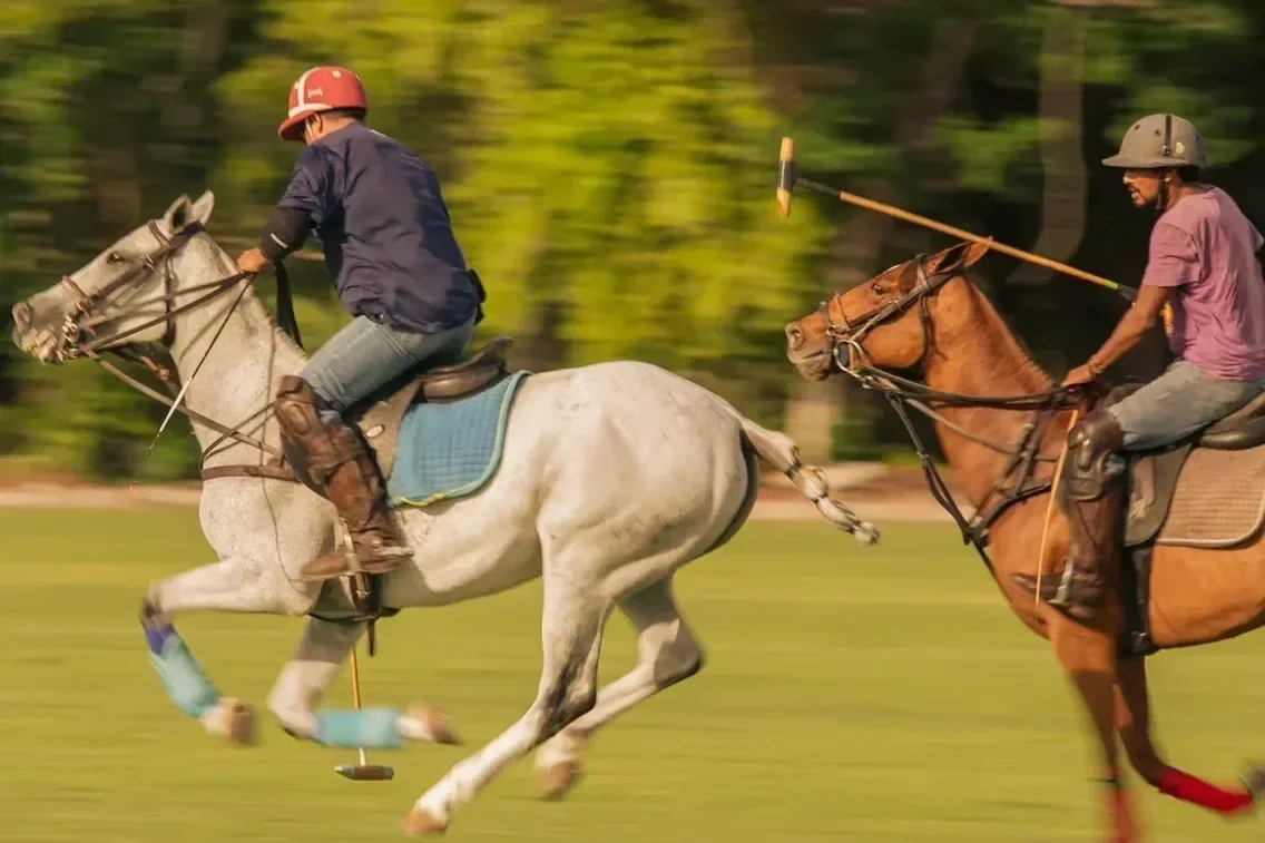 El Rey Polo Club near Puerto Morelos with players on horseback during a polo match