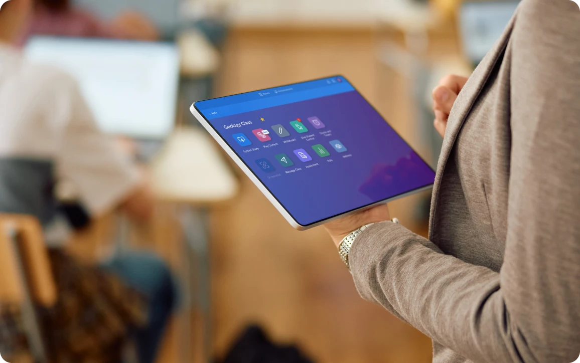 teacher-holding-tablet-dashboard.png