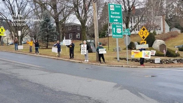 Citizen standing out with signs against toxic waste