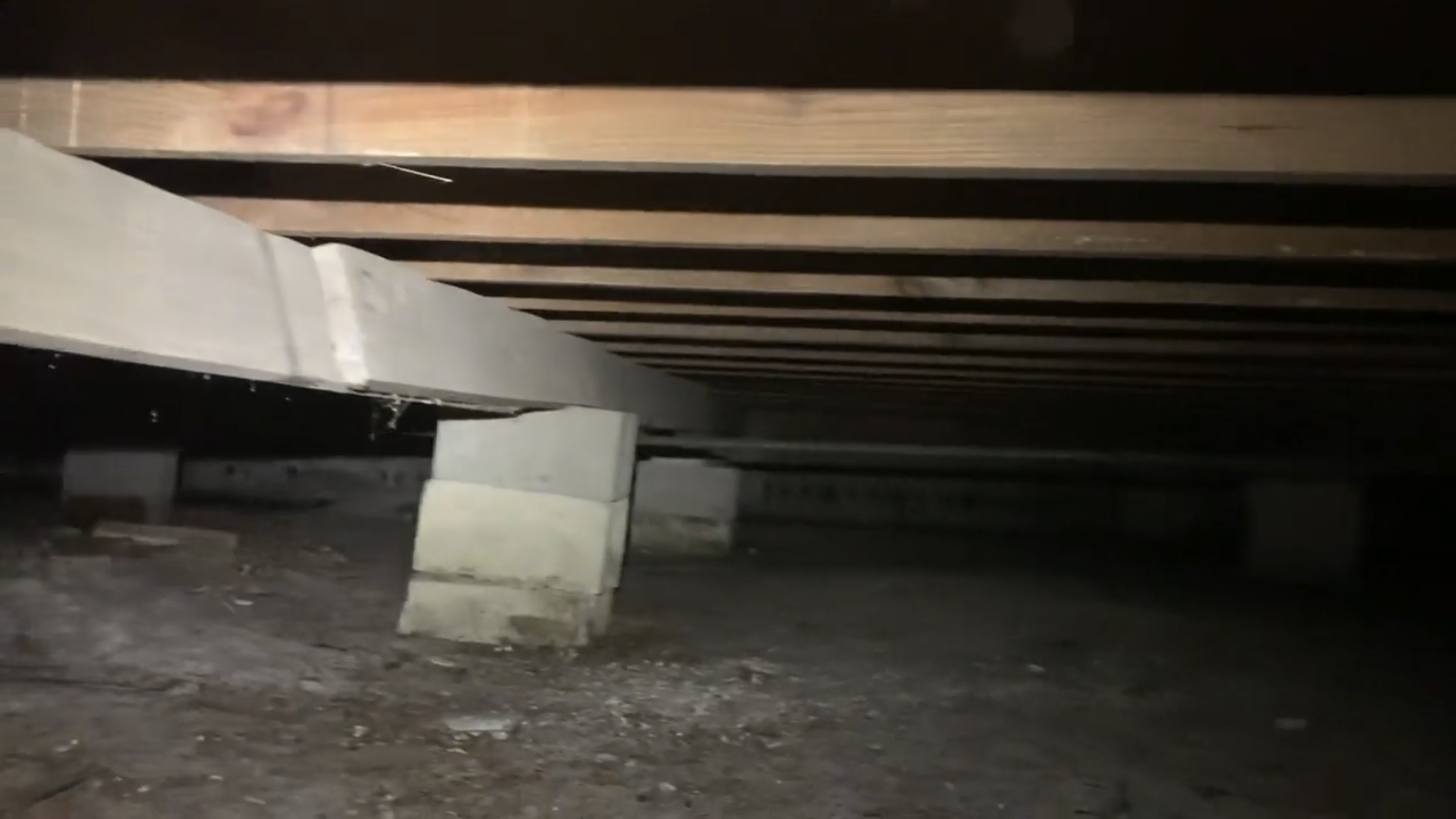 BEFORE-severely tilted beam near collapse (traditional home)