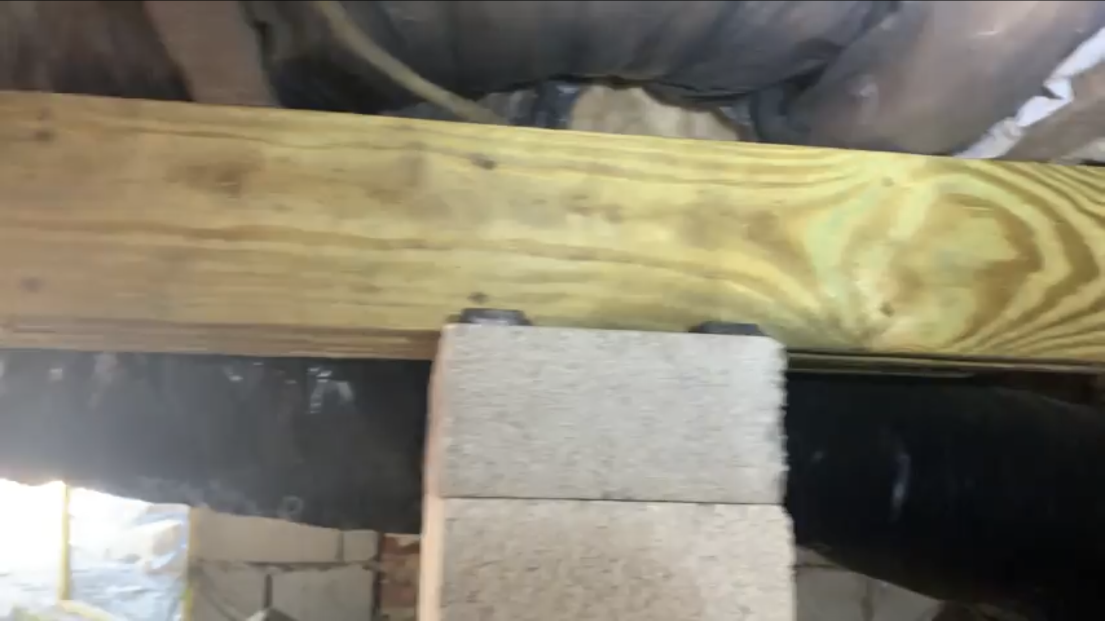 AFTER-close up of installed beam, pier, and composite shims (traditional home)