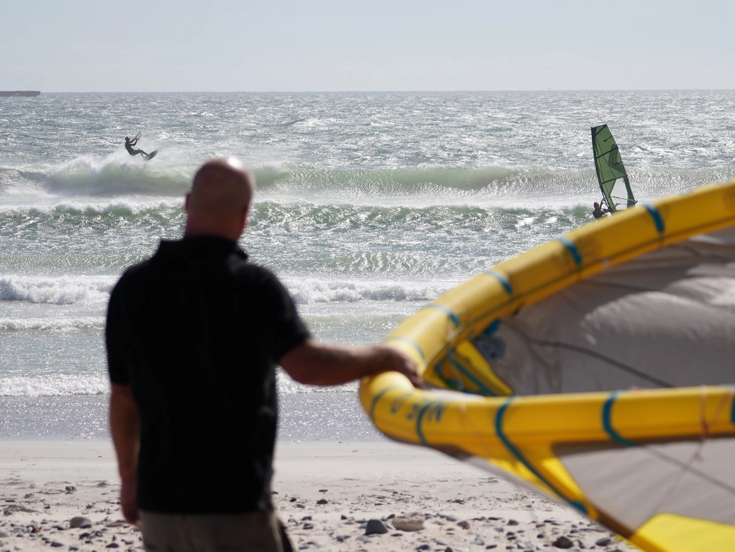 Person on the beach with a kite