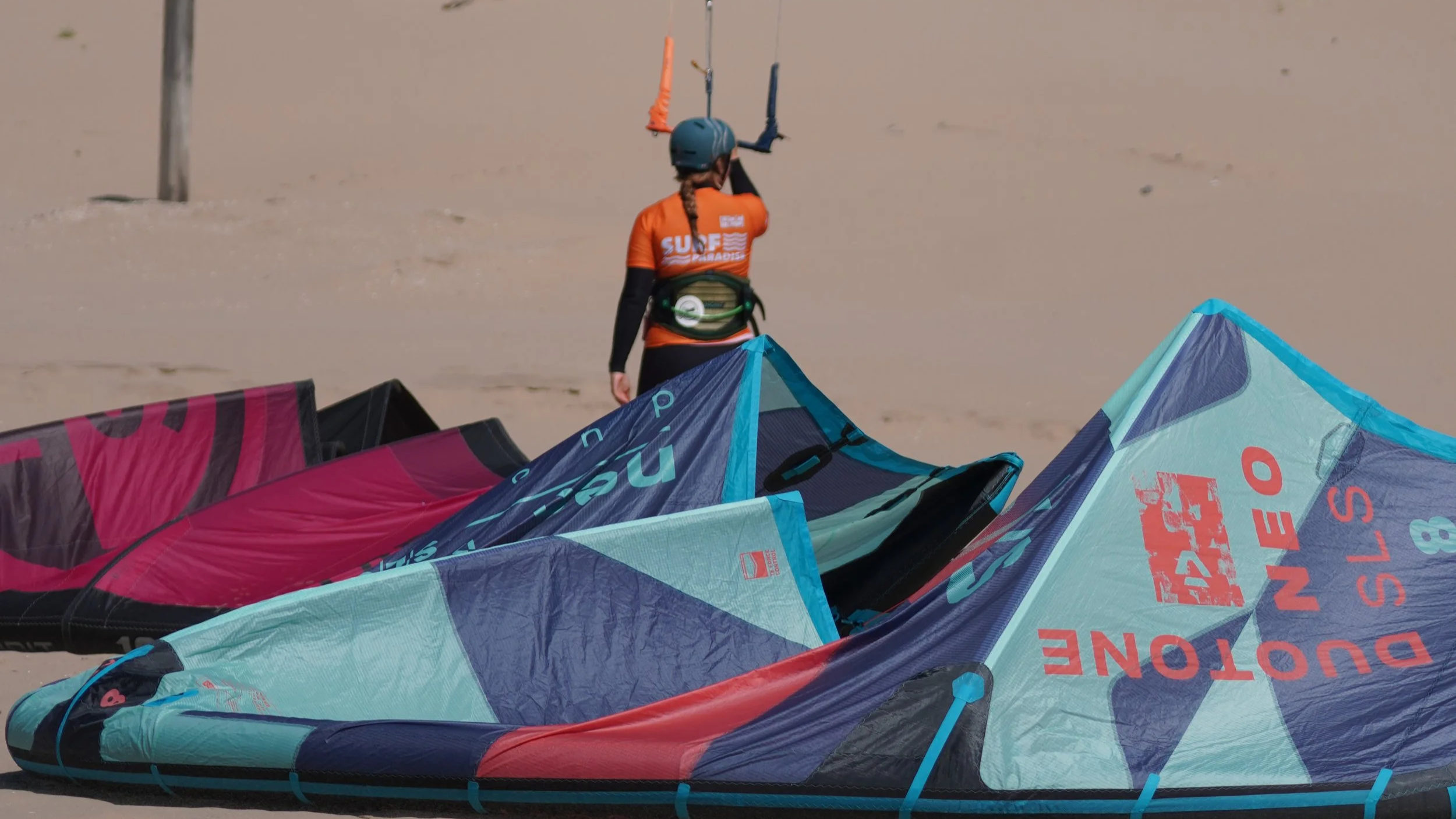 berito with multiple kites on the beach