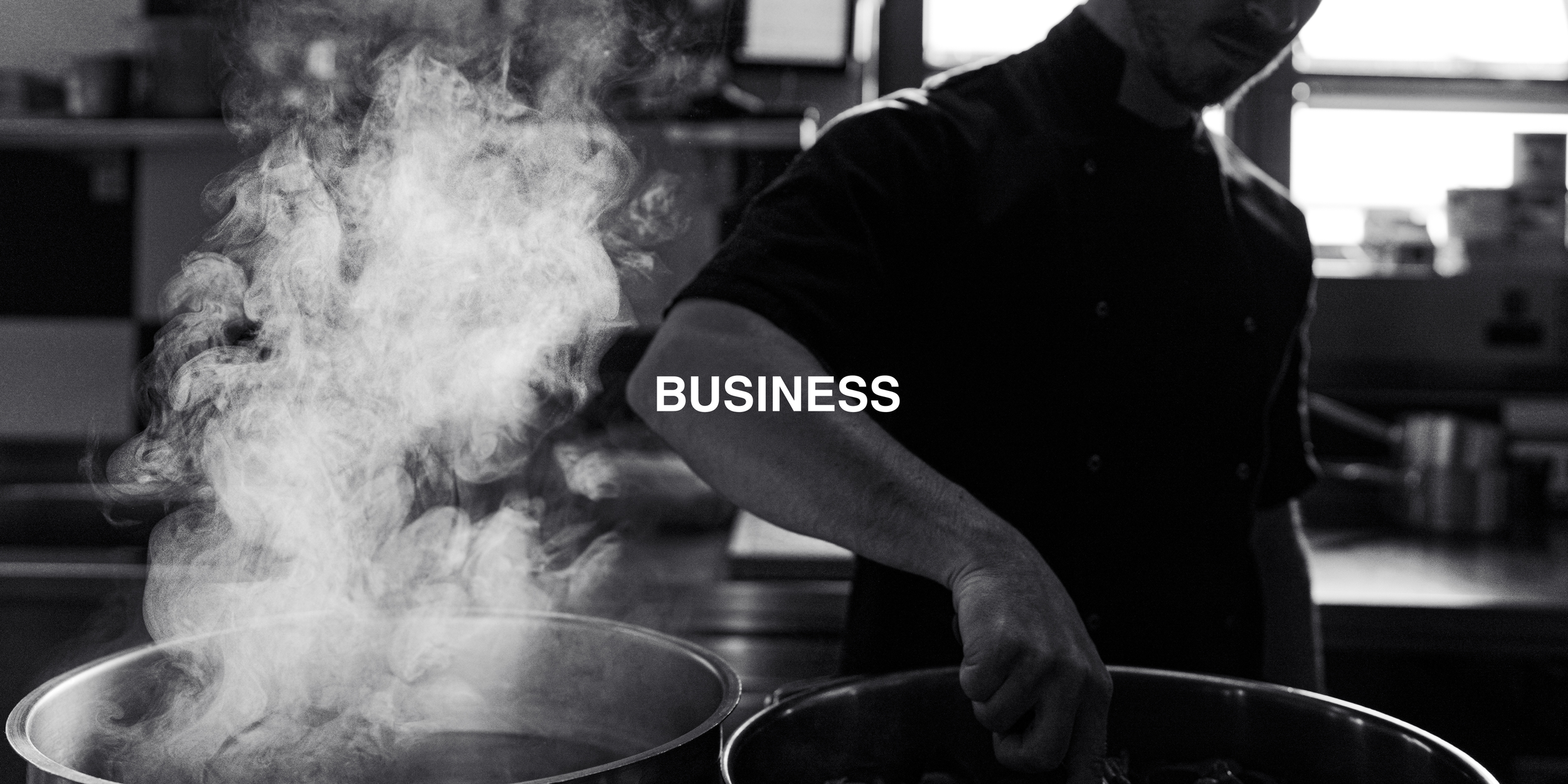 Chef cooking in a kitchen with steam rising from pots, overlayed with the word "Business."