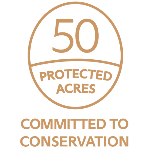 Logo with a circular border stating "50 Protected Acres" and "Committed to Conservation".