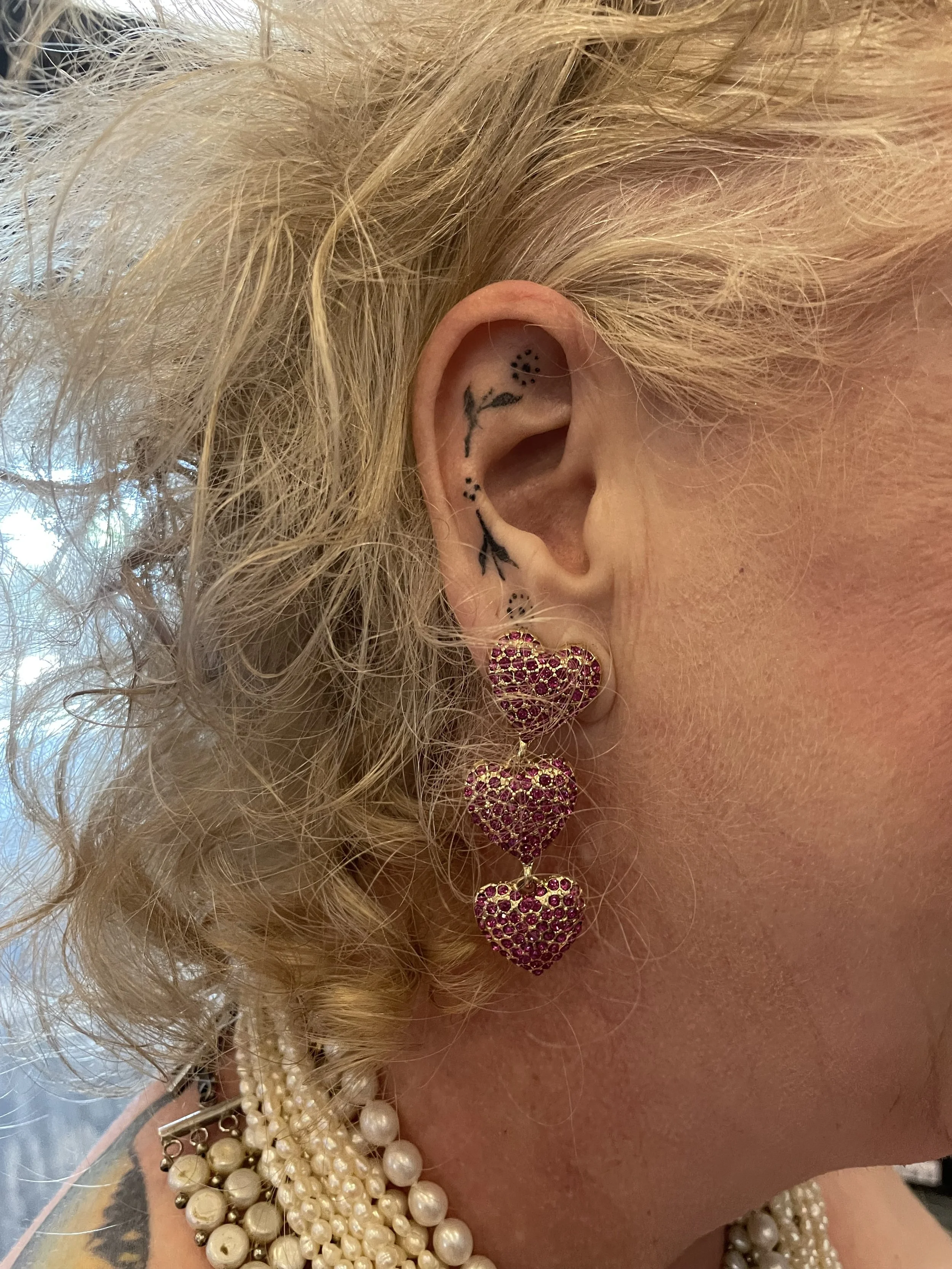 Tiny ear tattoo