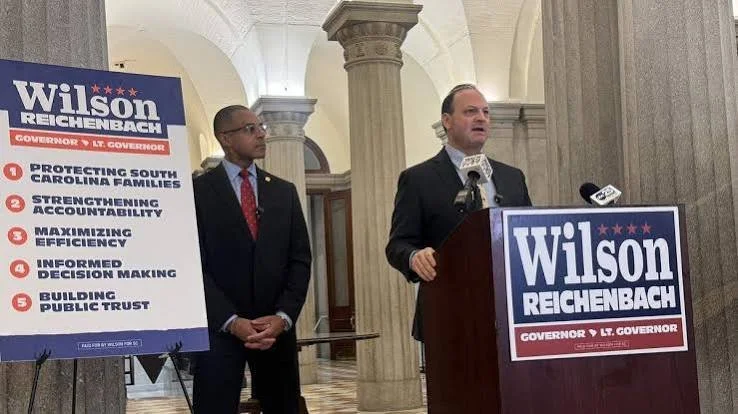 Attorney general Alan Wilson who is running for governor speaks about his plans for the Lieutenant governor's office while his running mate senator Mike Reichenbach listens.