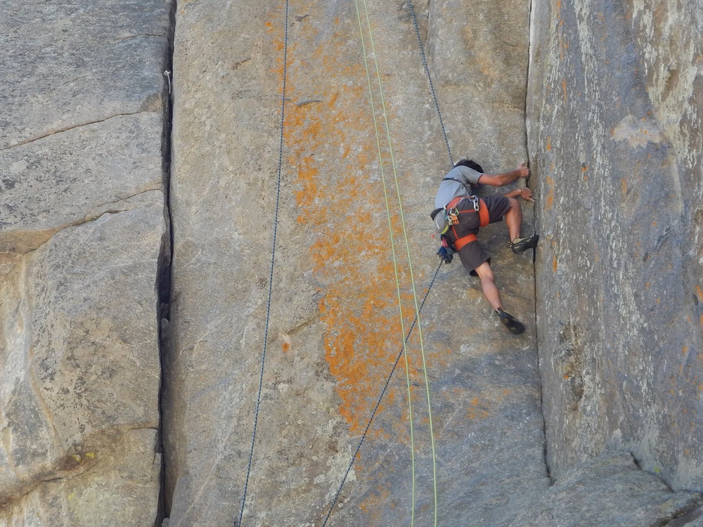 Climber moving on granite in Boulder Canyon