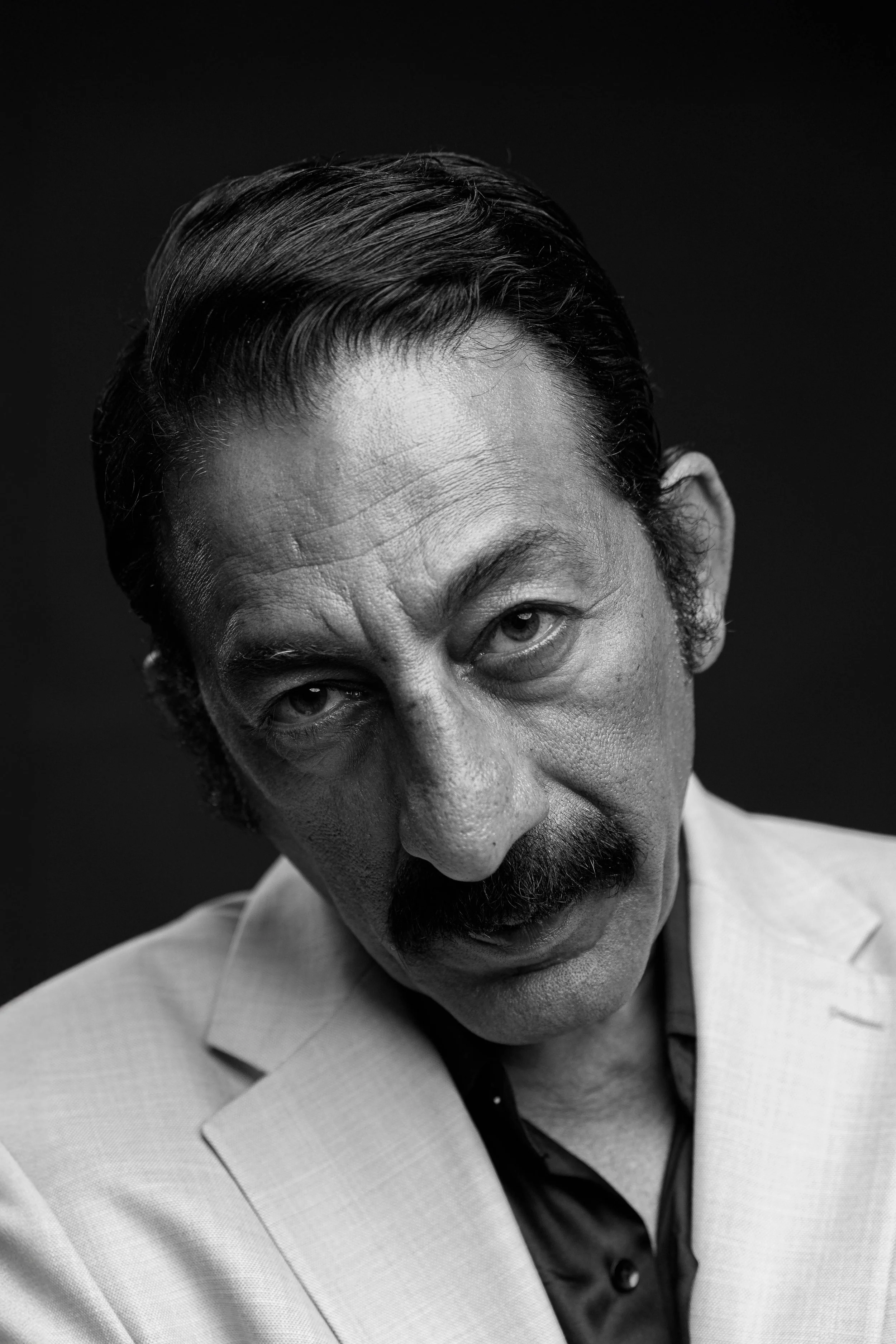 Houston black-and-white actor headshot by Levs’ Photography featuring a professional portrait with dramatic lighting, clean background, and expressive posing, ideal for casting submissions, auditions, and talent agency portfolios