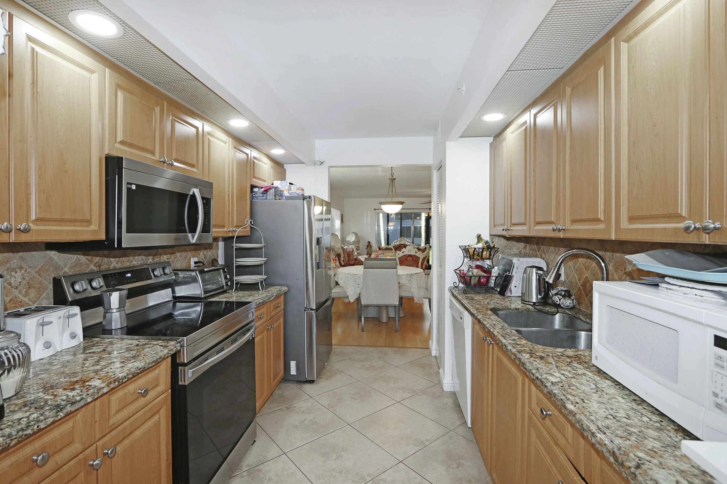 Large Kitchen with Granite Counter and Stainless Steel Appliances