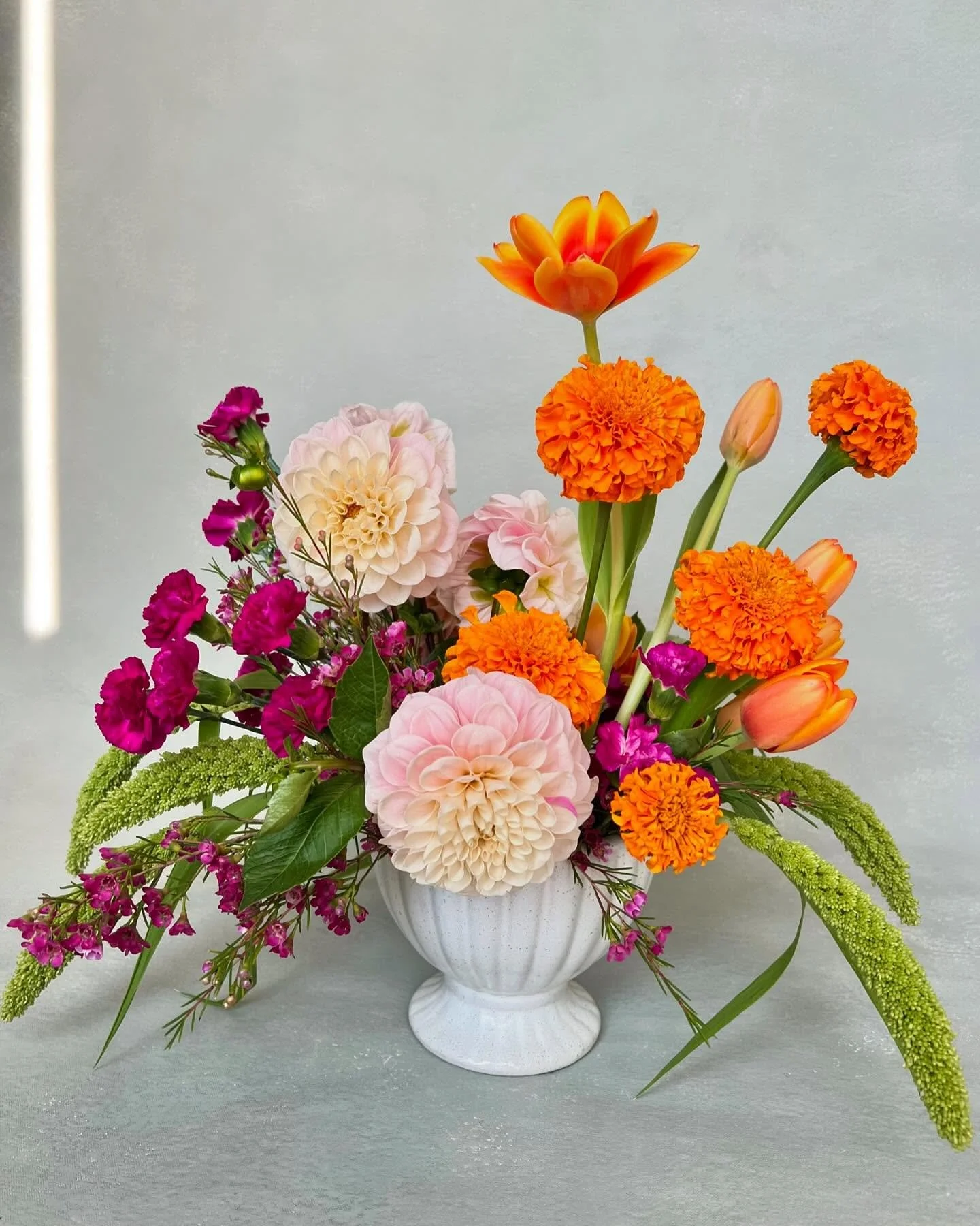 A Sunday well spent creating a small arrangement for my home! I love discovering the beautiful seasonal blooms at @traderjoes. I&rsquo;m obsessed with the vibrant dahlias this time of year and was thrilled to find marigolds to add a pop of color.

#F
