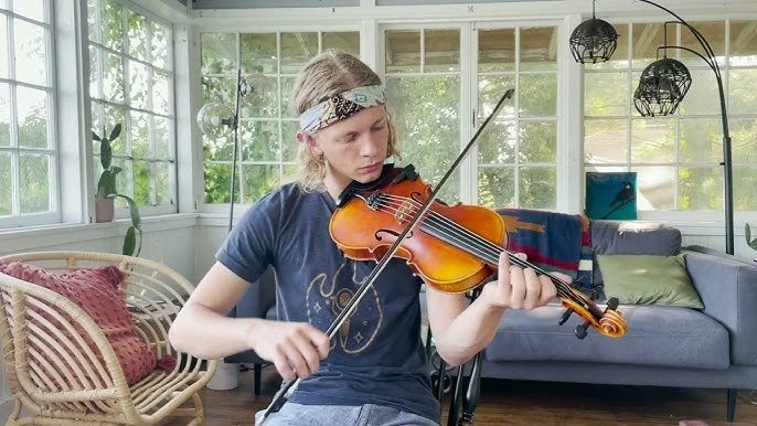Gus playing fiddle