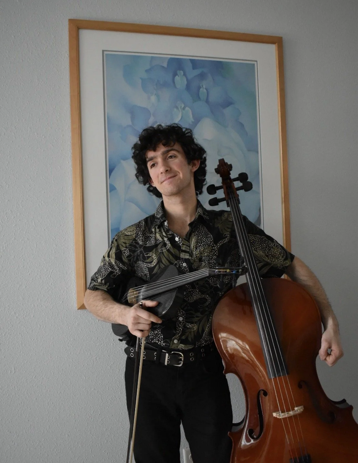 Sammy holding fiddle and Cello