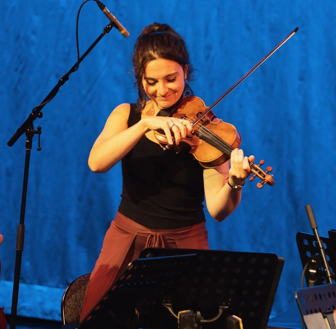 Lana playing fiddle