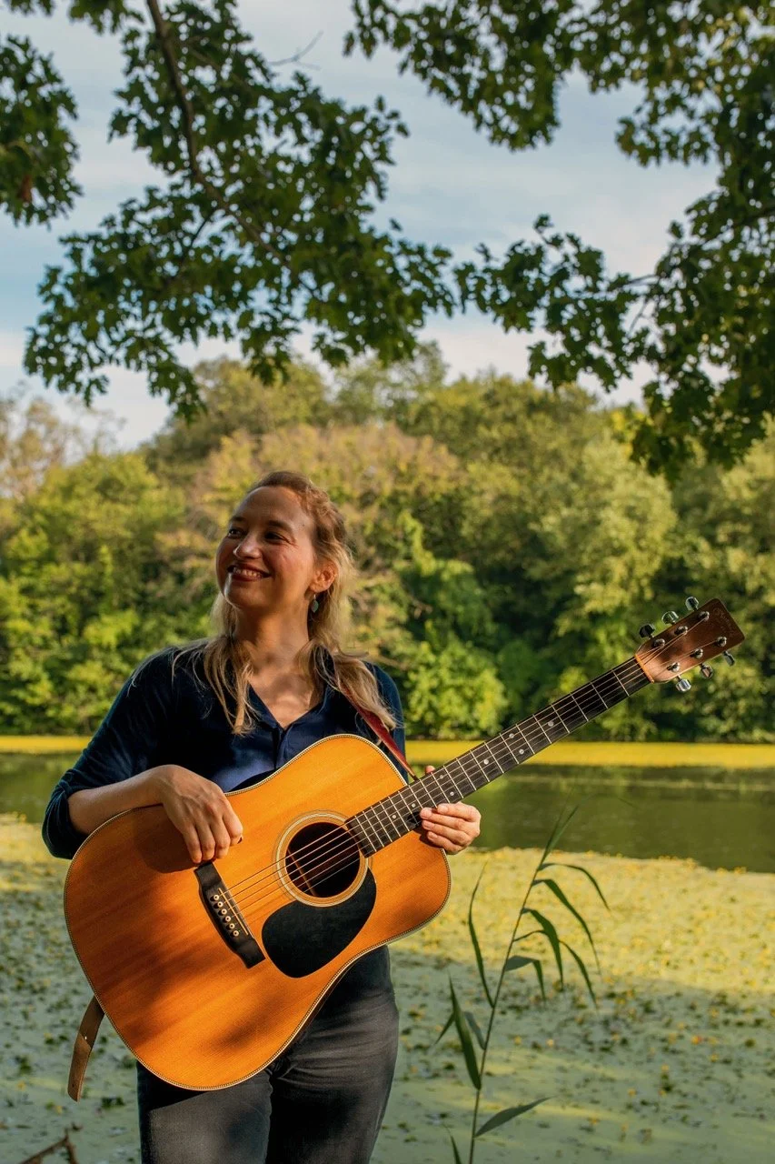 Alex Deane with guitar