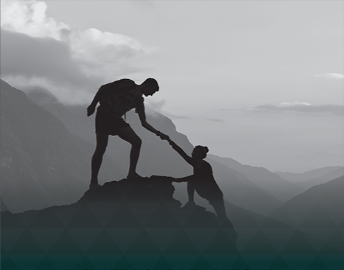 Leader helping others up in a mountain climbing setting