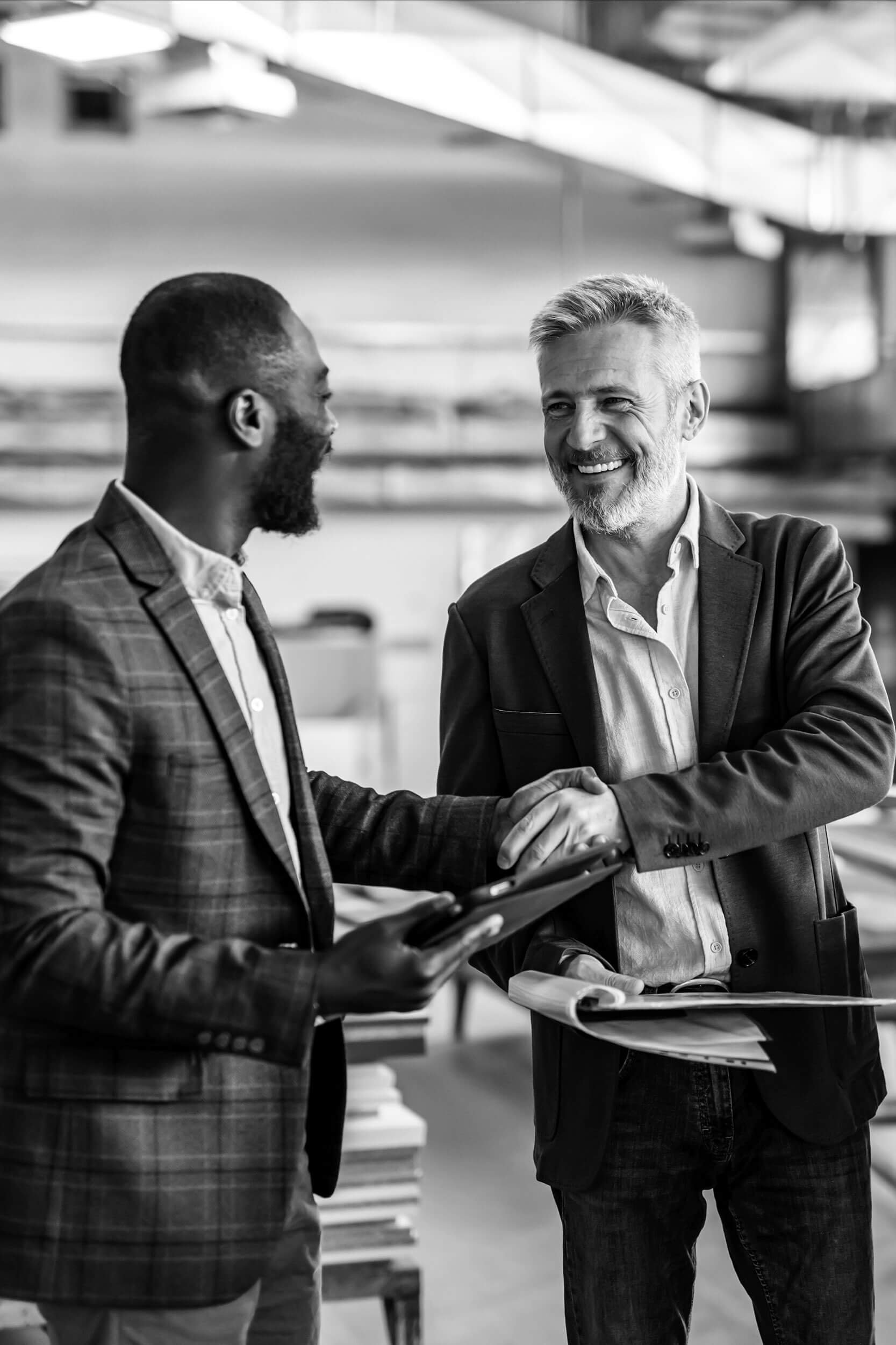 Confident commercial leader shaking hands with customer
