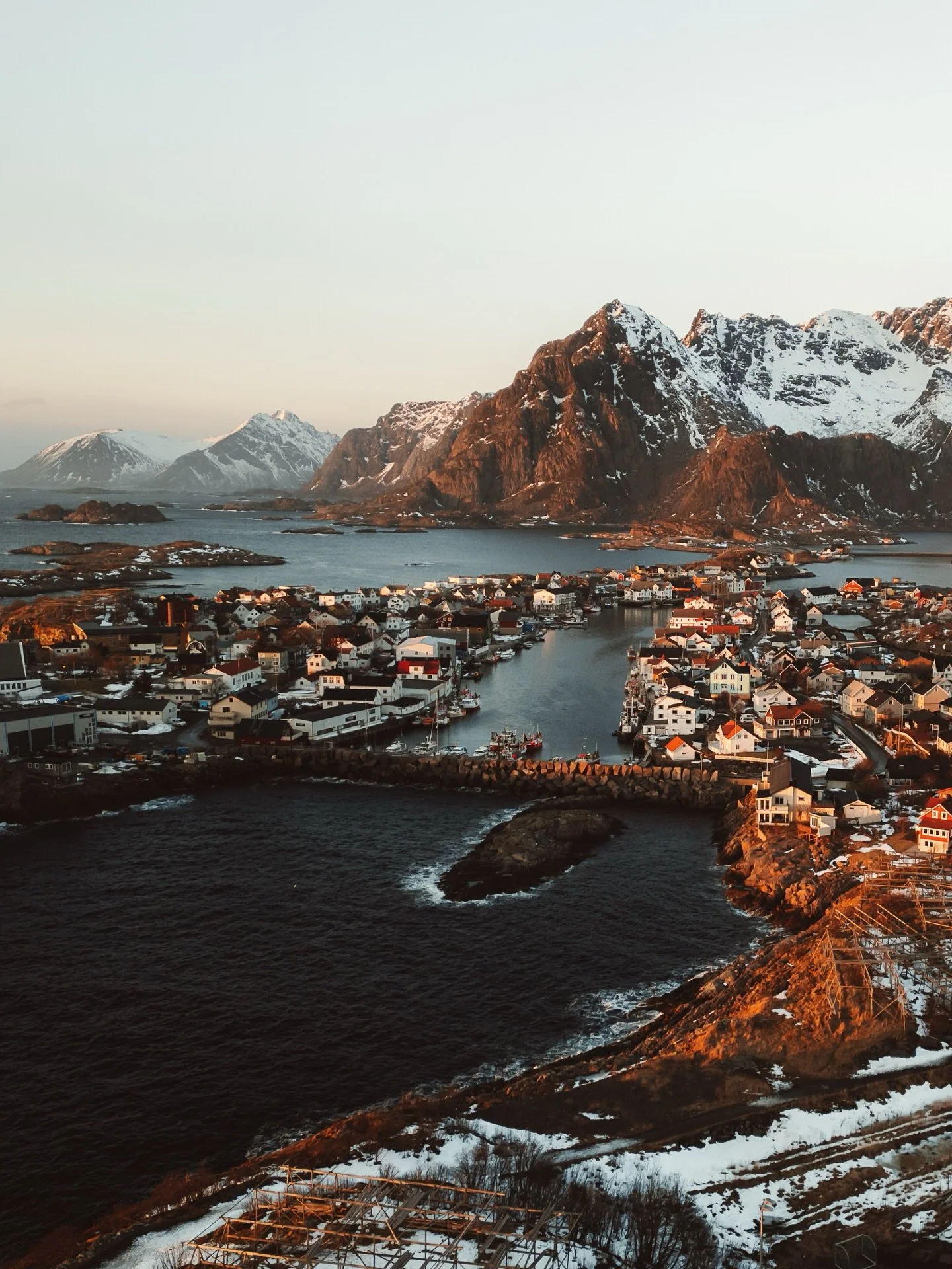 When the light does the heavy lifting. 

Golden hour over Henningsv&aelig;r making this epic place even more special to photograph. Mix of both drone and camera photos. This fishing town is a special one.