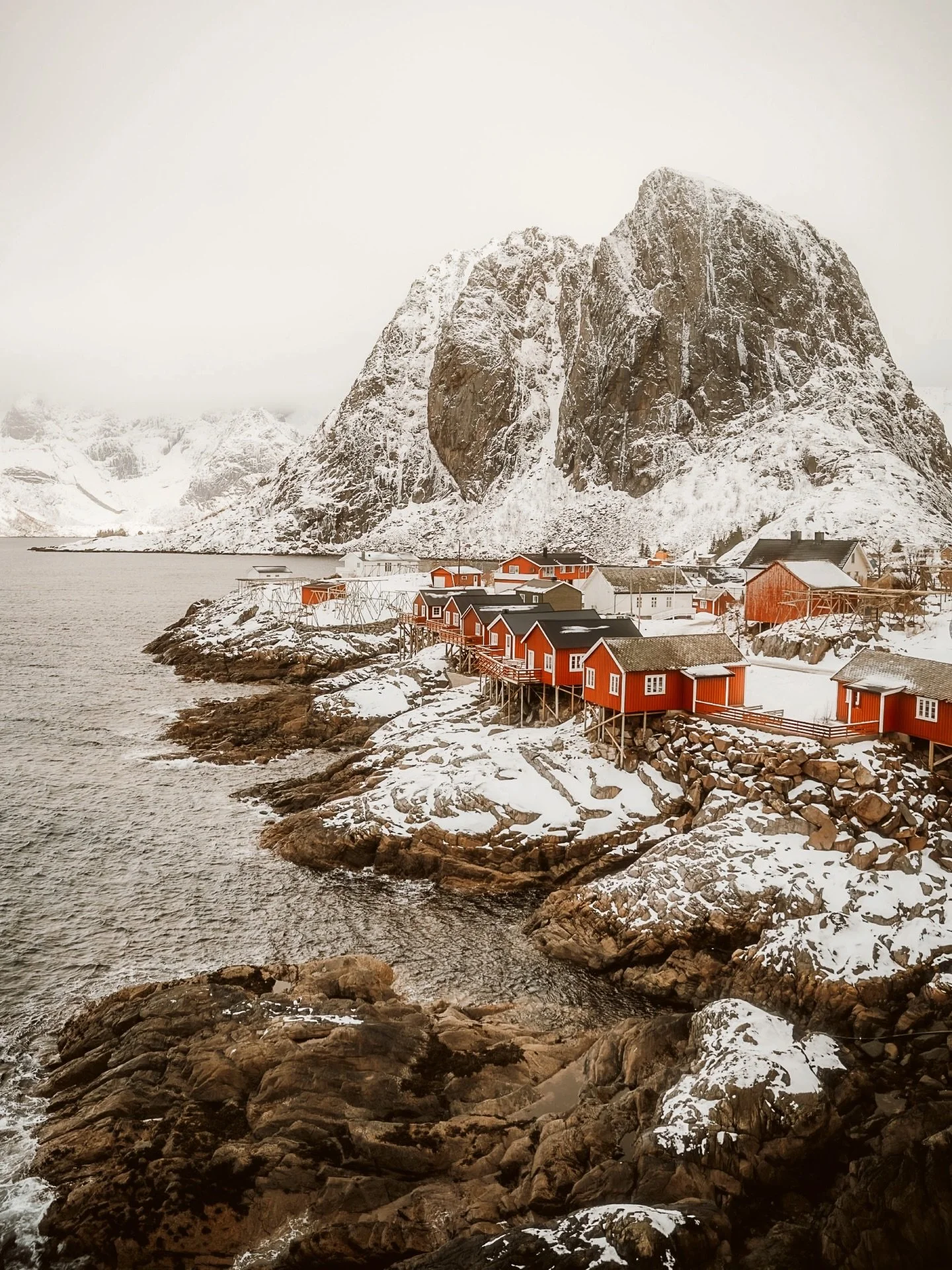 Seeing red.
The iconic red cabins of Hamnoy in the Lofoten Islands&mdash; this time captured in the middle of a snowstorm. Standing bold against a now white backdrop, photographing this place never gets old, but the added challenge of being out in th