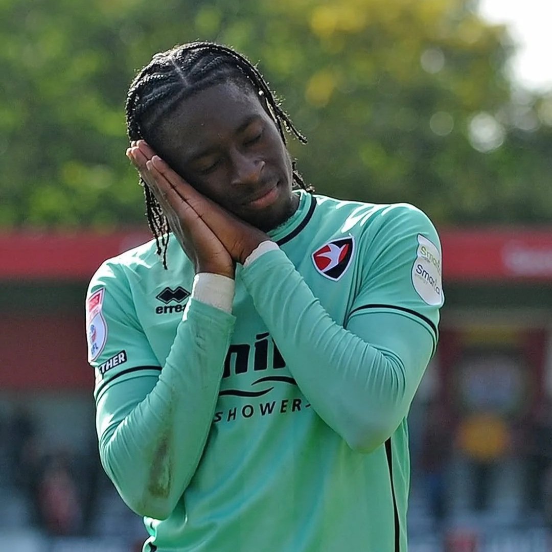 Ethon Archer celebrating scoring for Cheltenham Town