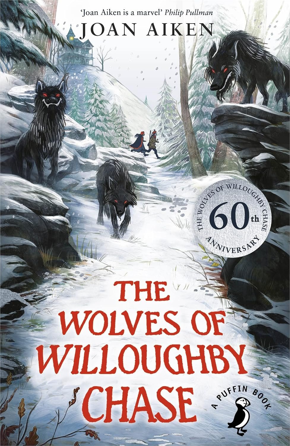 Image shows book cover of The Wolves of Willoughby Chase by Joan Aiken. Two young children run through a snowy landscape, while wolves prowl the path, their eyes glowing red