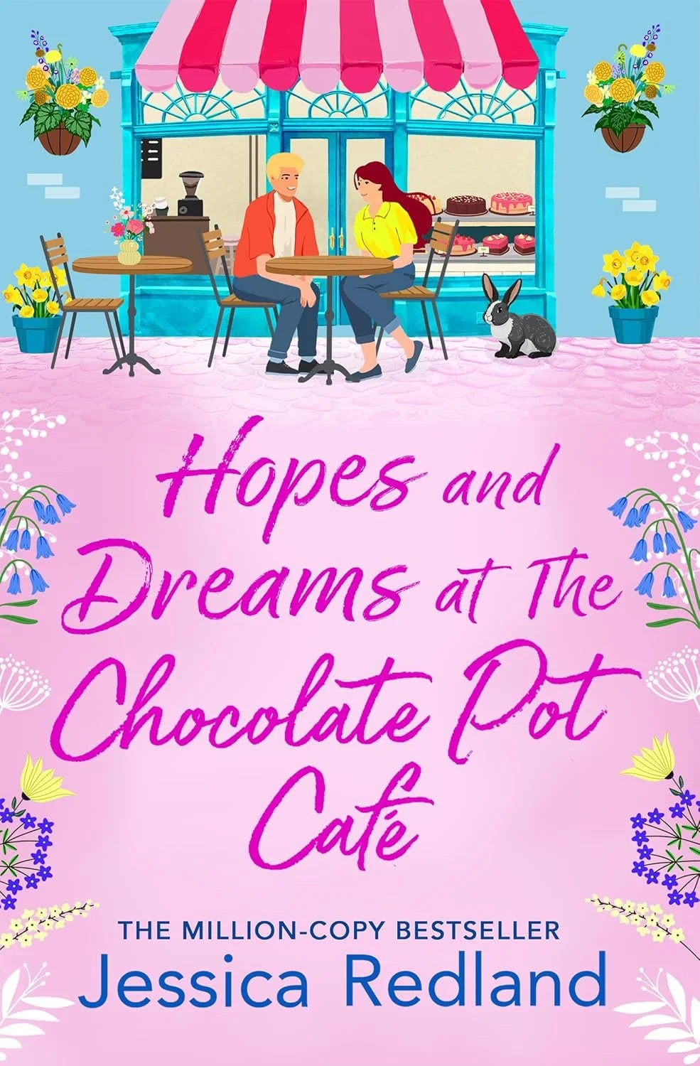 Cover of Hopes and Dreams at the Chocolate Pot Cafe by Jessica Redland. Title and author name on pink foreground. Couple sitting at a table outside a cafe that has cakes in the window. Large rabbit sits beside the woman.