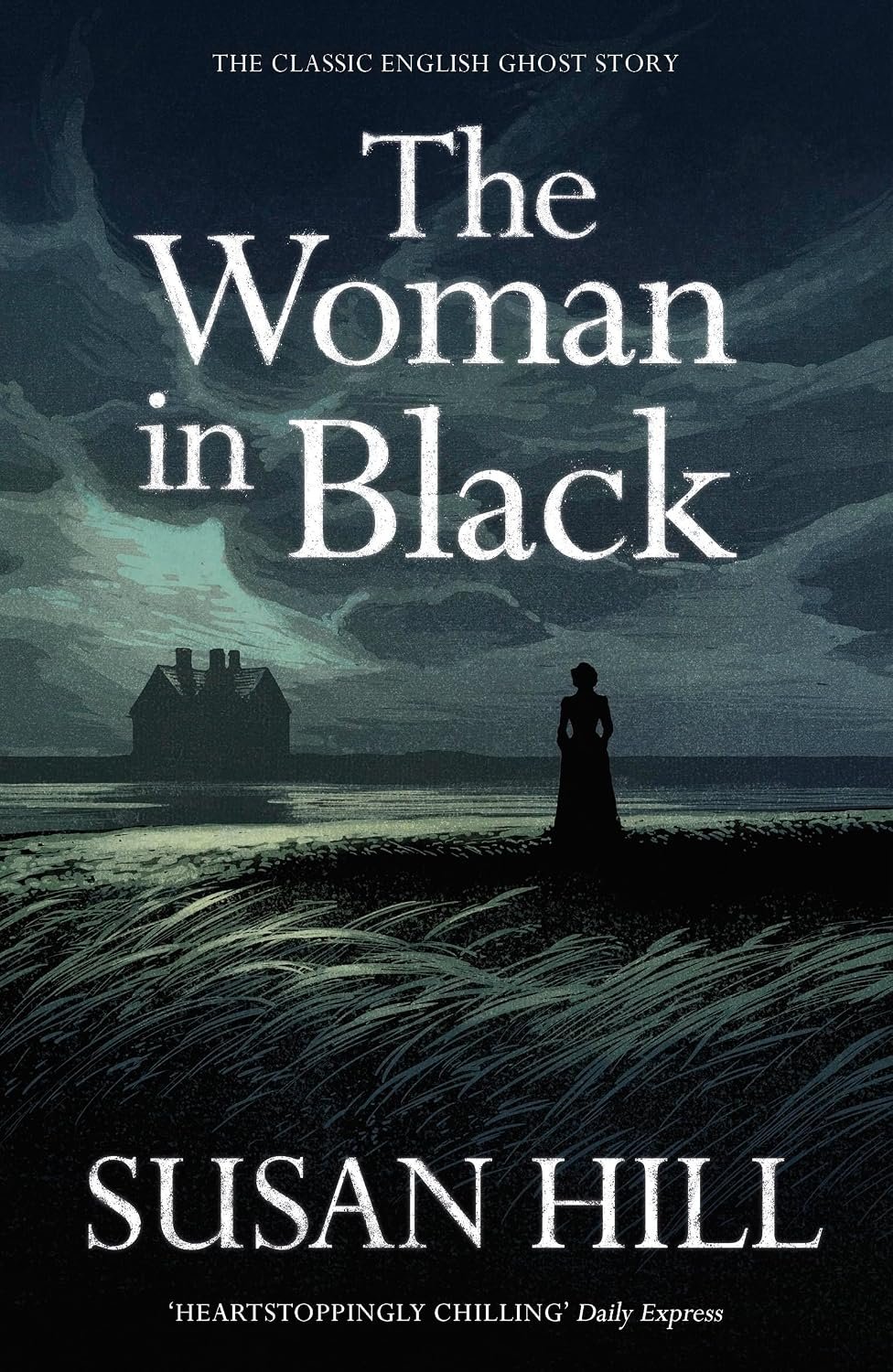 Cover of The Woman in Black by Susan Hill showing the silhouette of a woman standing in a marshy landscape watching an old house in the darkness