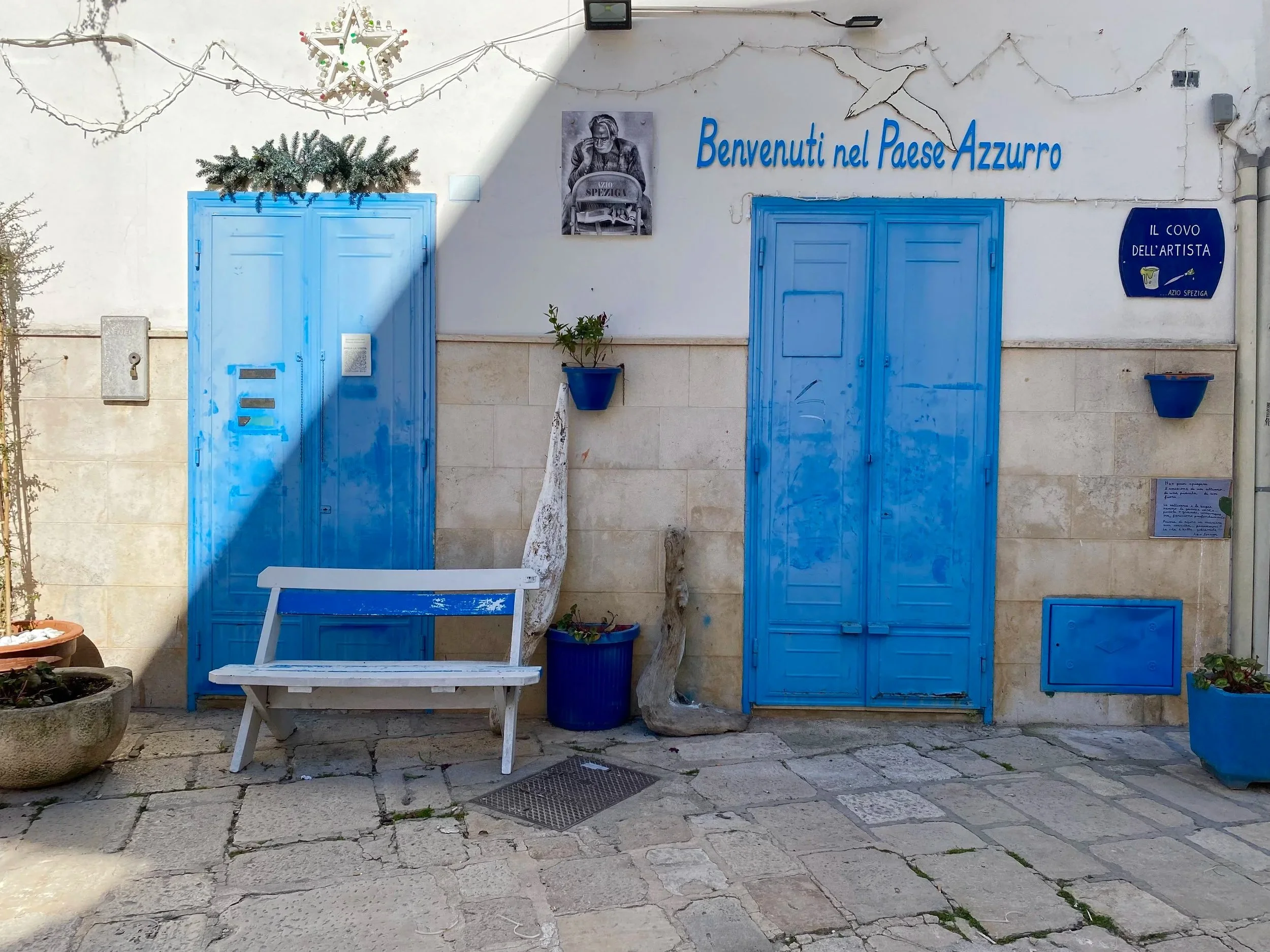 Bright blue doorways in the town of Casamassima, known as the "blue town" in Puglia.