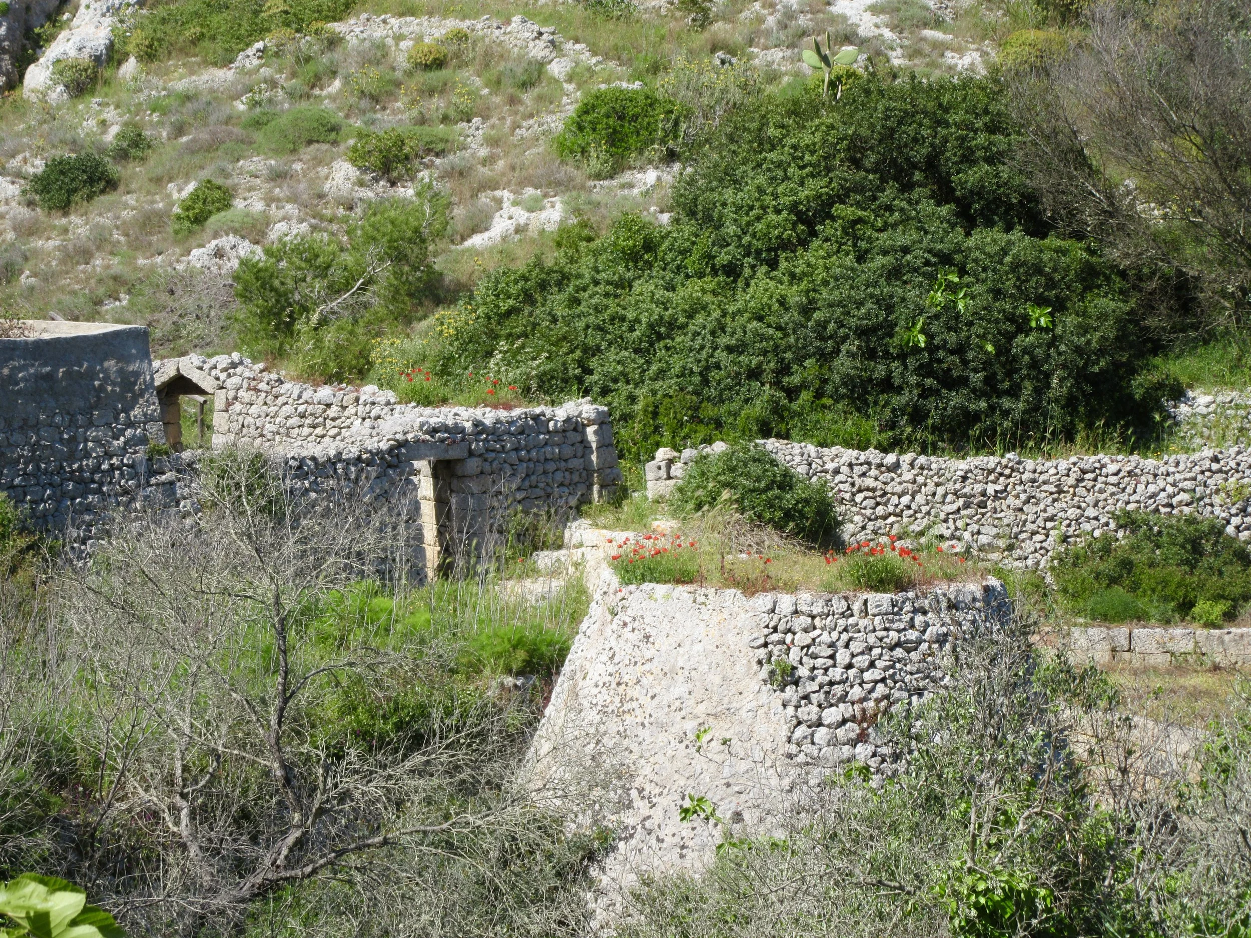 Old stone walls and buildings in the countryside of Gagliano del Capo.