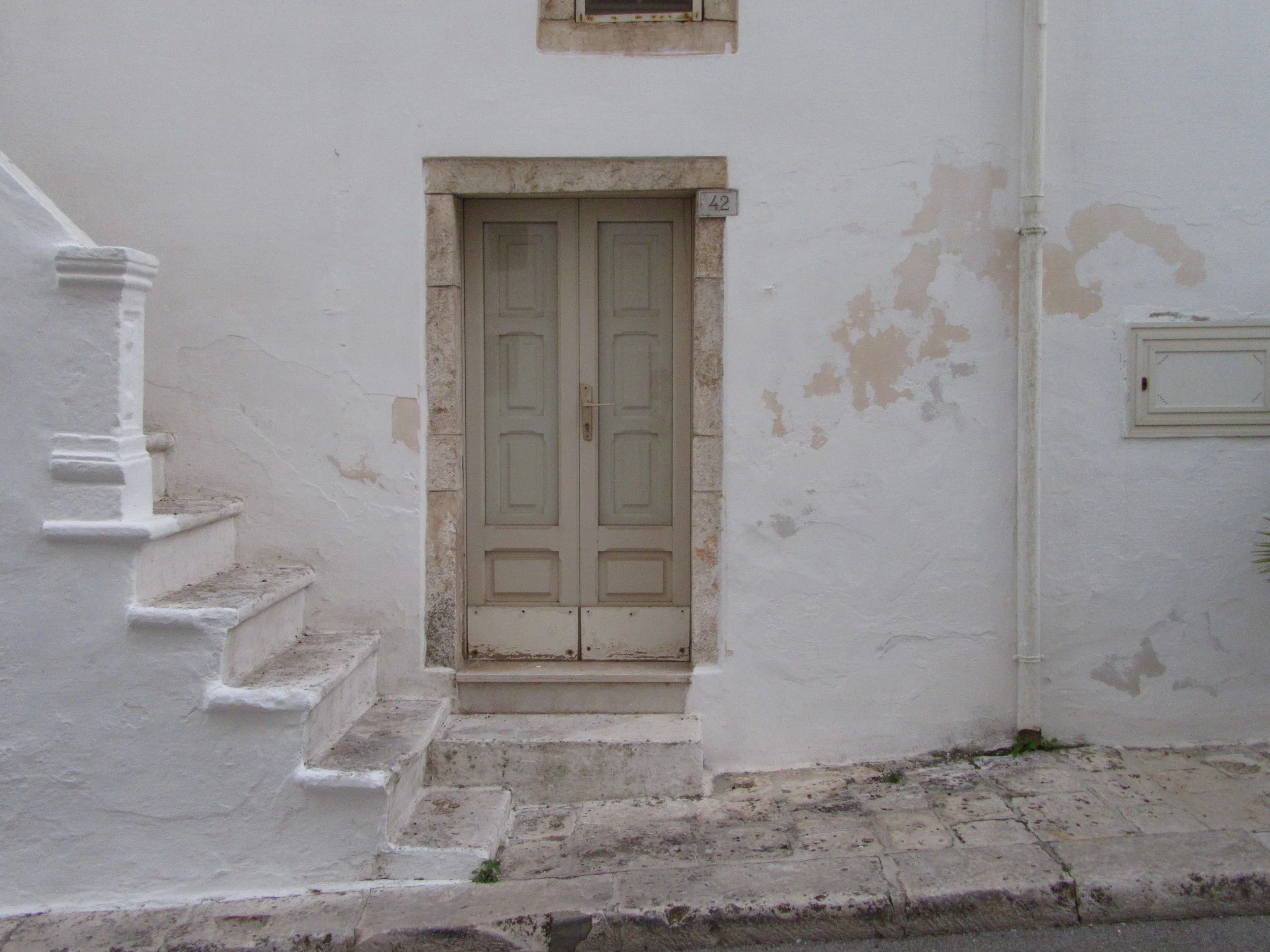 The front of a white-washed home in Locorotondo, Puglia.