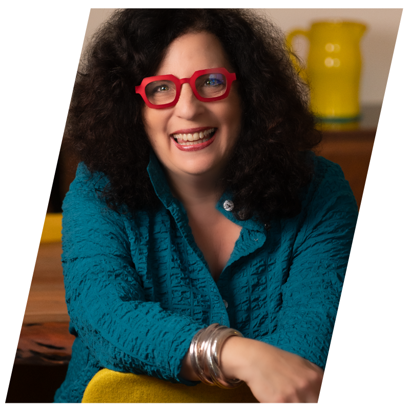 Deborah Headshot with red glasses.