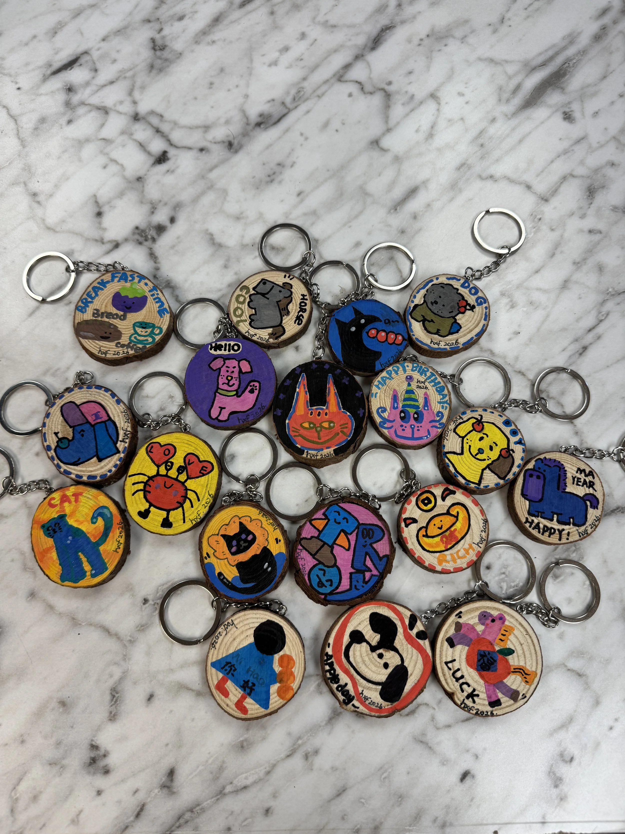ASSORTED HAND-PAINTED WOODEN KEYCHAINS