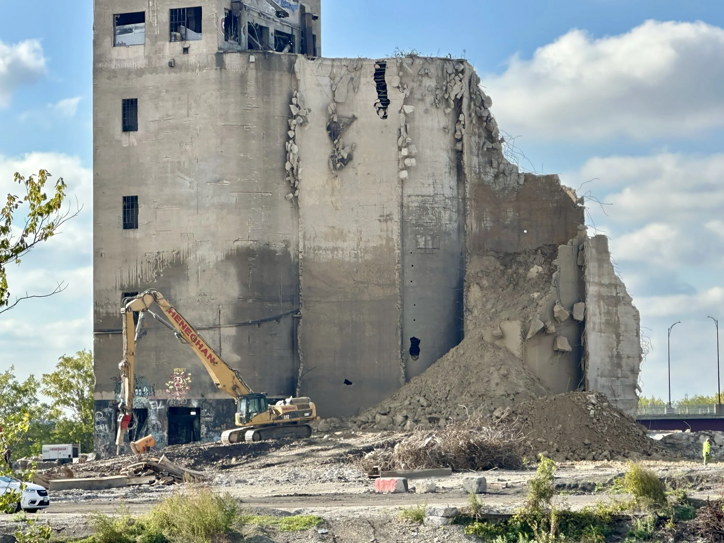 Oct 14: River Barrier Replaced, Filled Silo Slows Work